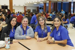 Four teachers smile together at the 3rd Annual AIM High event.